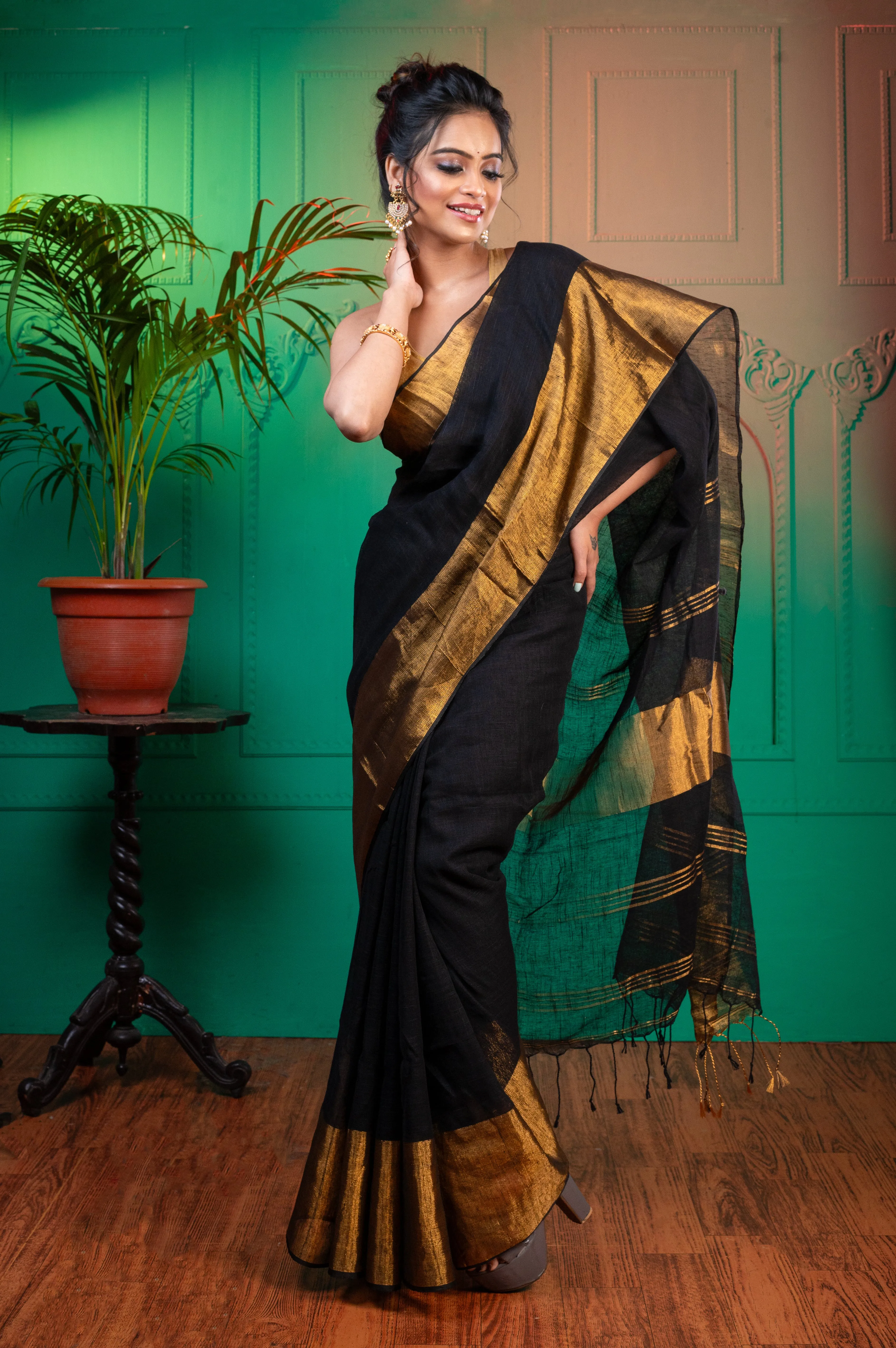 Women Black Pure Handloom Linen Saree With Golden Zari  Border And Pallu